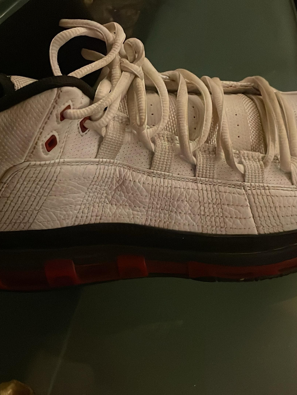 White Low-Top Athletic Sneaker with Red Accents